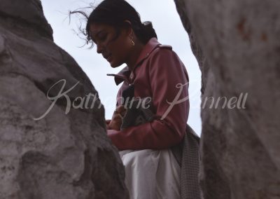 woman between rocks
