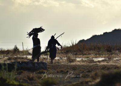 farm women carrying fire wood